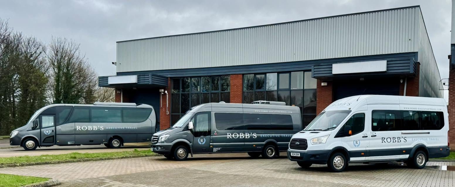 The full Robb's Travel fleet, lined up together outside our depot