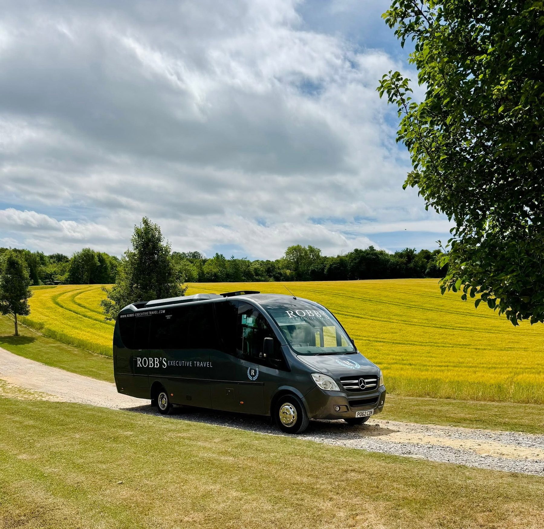 Luxury 27 Seater Coach on the road, Gloucestershire countryside