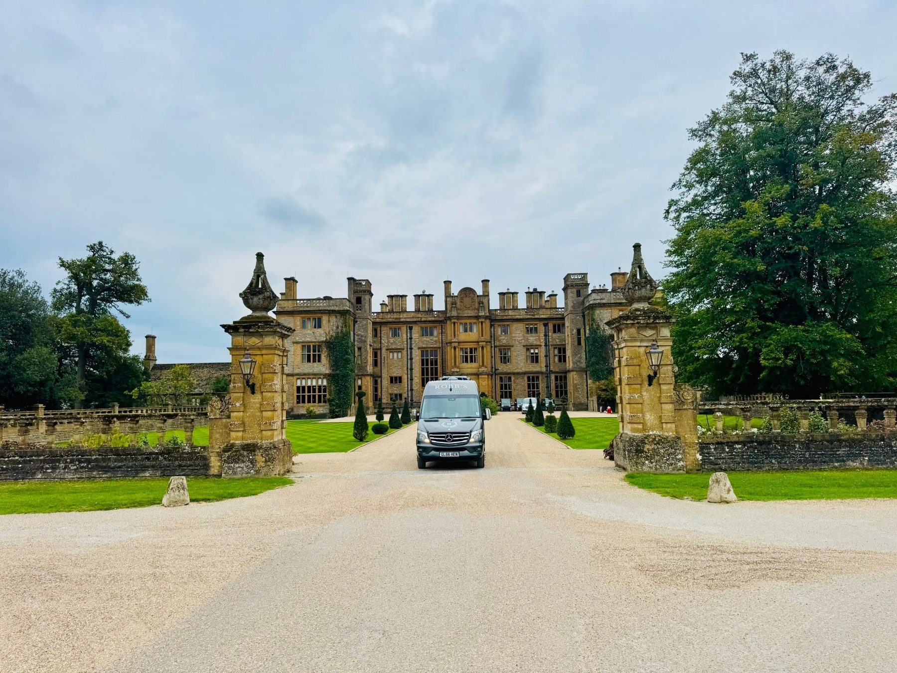 Robb's minibus arriving at a Cotswolds manor house for a corporate event