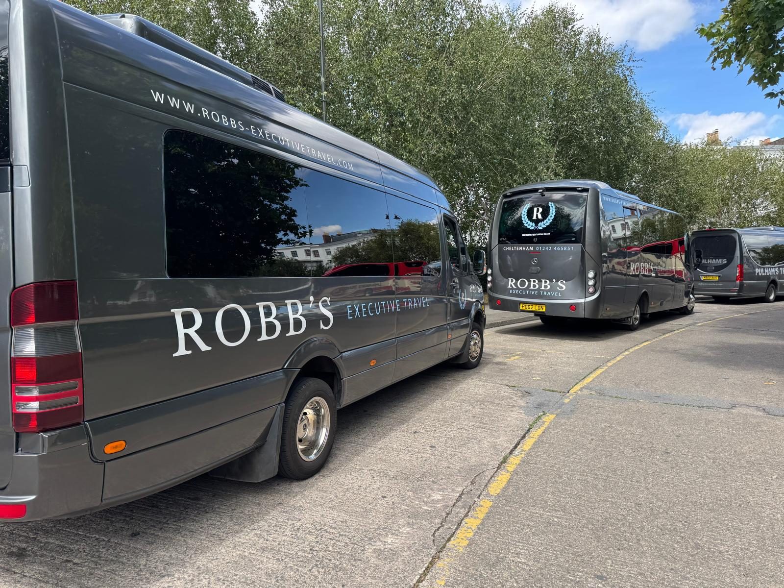 Robb's minibus and coach, side by side on the street