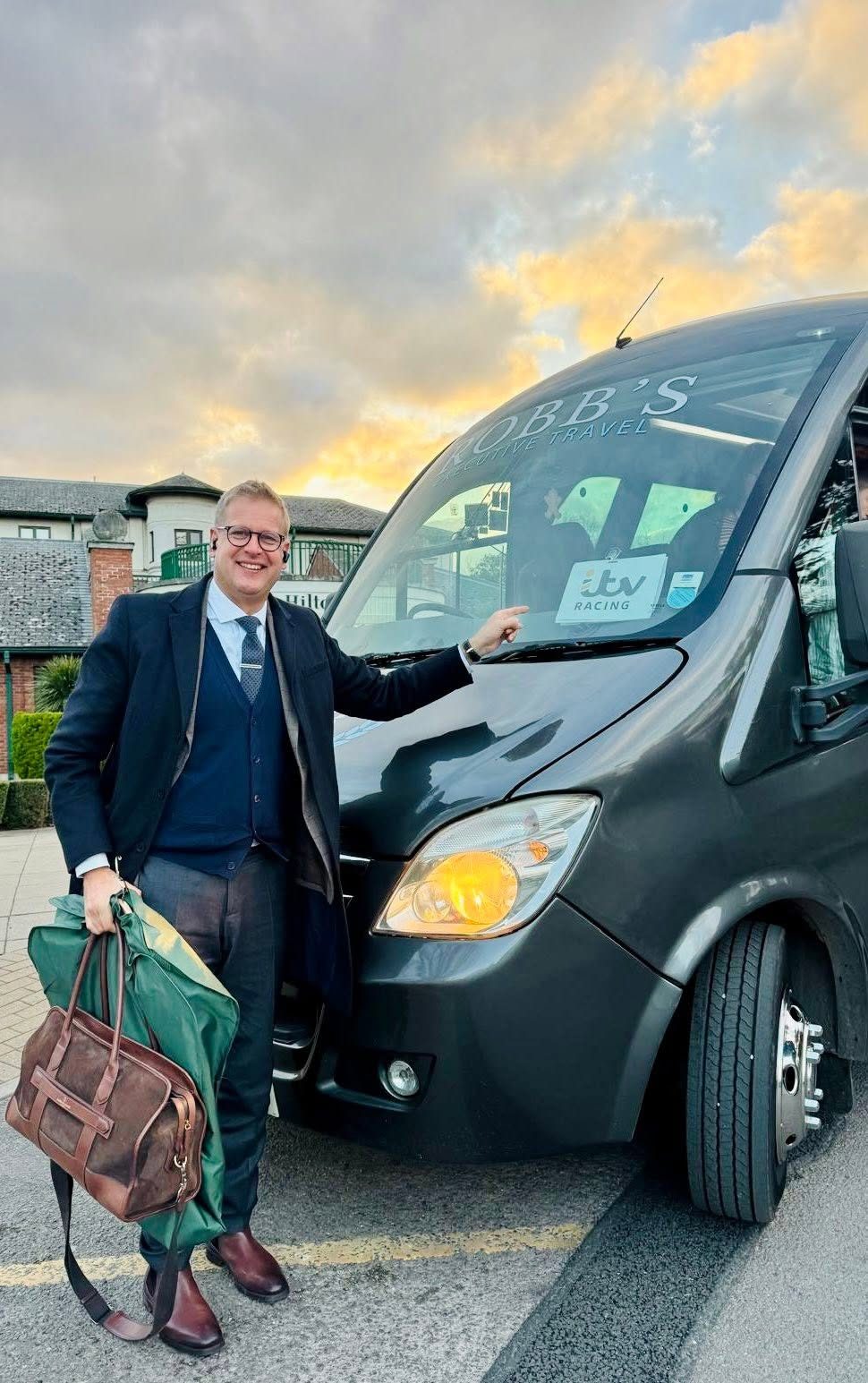 Ed Chamberlin being collected by a Robb's VIP mini coach ahead of ITV Racing coverage at the Cheltenham Festival