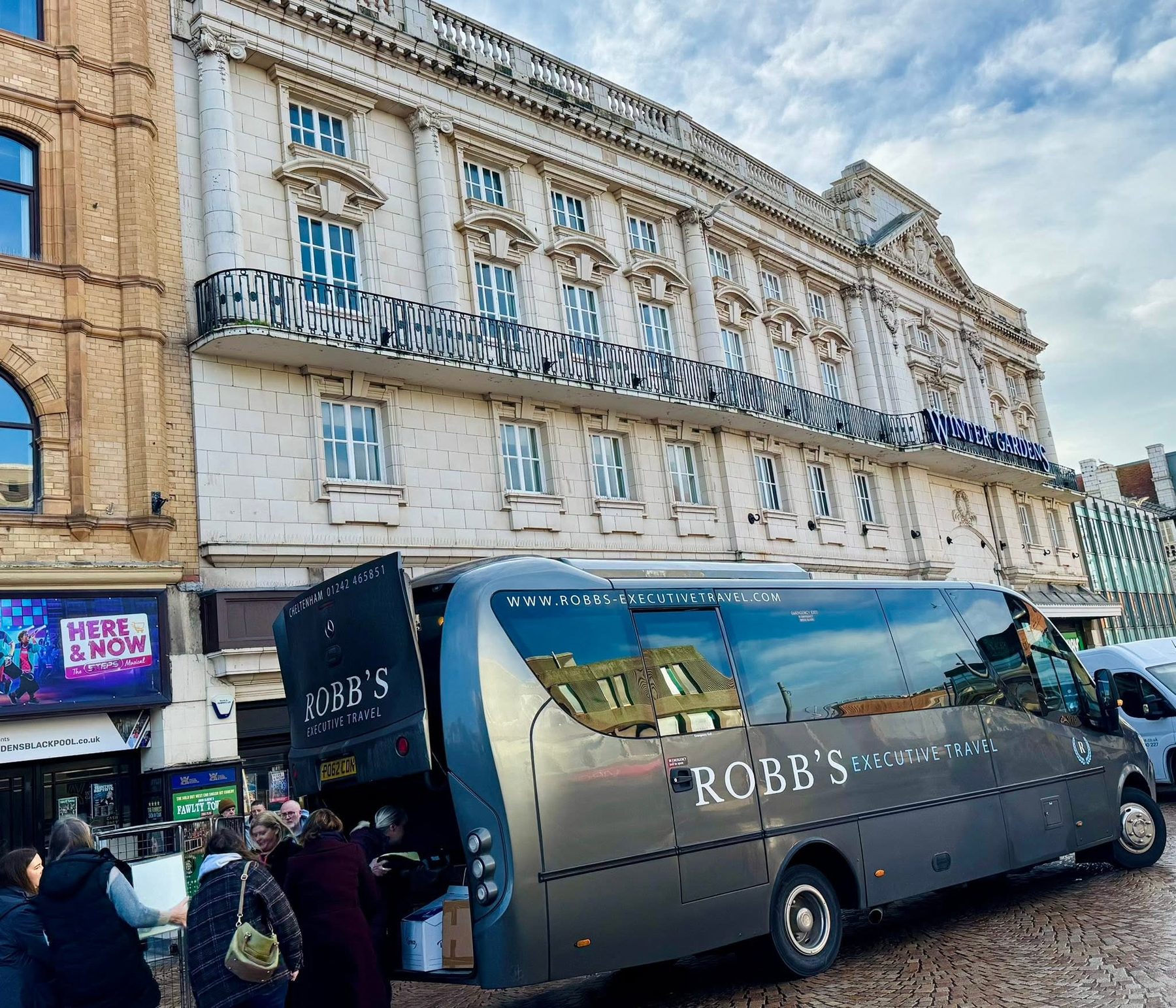 Loading luggage from a Robb's coach outside the Blackpool Winter Gardens